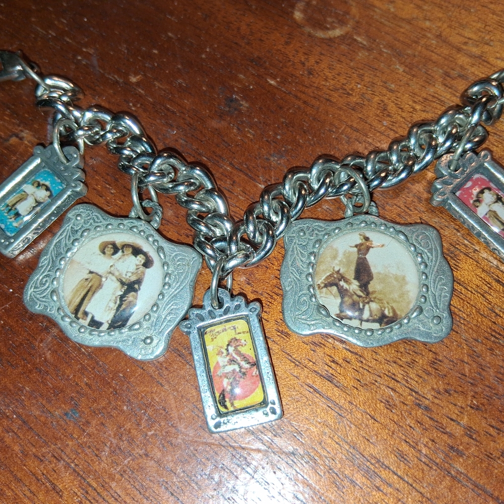 Vintage Silver Charm Bracelet with Artistic Pendants